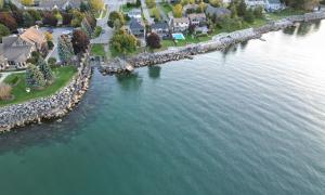 Hardened shoreline near stormwater outlet under Niagara Peninsula Conservation Authority's jurisdiction. Stoney Creek, Ontario. Great Lakes Water in Action. Katie Franken.