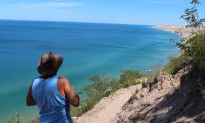 Enjoying the view just East of the log slide with Lake Superior dunes. Near Devil's Slide not far from Grand Marais., Michigan. Recreation. Randy Fretz.