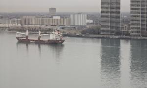 A view of a merchant ship on the Detroit River looking from Windsor, ON in Canada towards Detroit, MI in the U.S. Detroit, Michigan. Great Lakes Water in Action. Dawn Schilling.