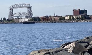 Working port of Duluth: rocky shore, floating ice chunks and the Lift Bridge. Duluth, Minnesota. Great Lakes Water in Action. Lisa Fitzpatrick.