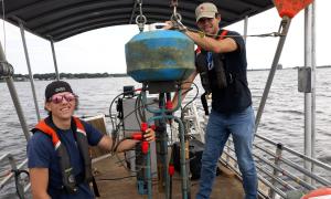 Researchers prepare to deploy underwater sensors for continuous monitoring of water quality in Muskegon Lake - an urbanized Great Lakes estuary that joins Lake Michigan. Research, Education and Science. Bopi Biddanda