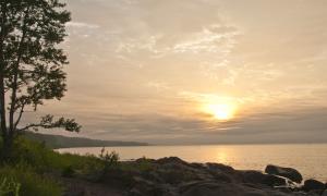 A sunrise over Brighton Beach, Duluth, Minnesota. Great Lakes Water in Action. Michael Kris Anderson.
