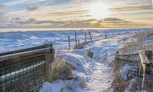 Snow covered pathway to the shore, Duluth, Minnesota. Great Lakes Water in Action. Michael Kris Anderson.