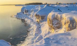 Ice formations along Minnesota Point, Duluth, Minnesota. Great Lakes Water in Action. Michael Kris Anderson.