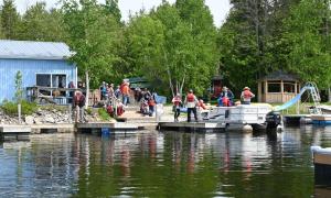 Birders prepare for a bird watching boat ride of the Fishing Islands, Lake Huron. Red Bay, Ontario. Gord McNulty