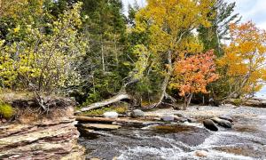 Fall colors on the shore. Pictured Rocks National Seashore, Michigan. Great Lakes Water in Action. Lawrence Patrick