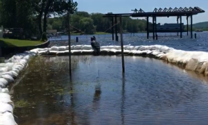 A flooded front yard during record high water levels in Lake Ontario in 2017. Wolcott, NY. Great Lakes Water in Action. Chelsea Spiegel