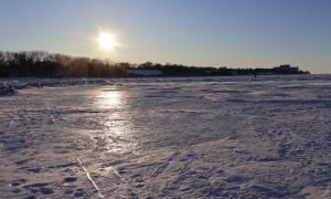 Iced over Lake Erie at sunset. Cleveland, Ohio. Great Lakes Water in Action. Lorin Hancock