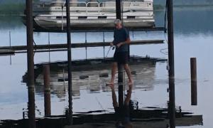 Walking on water during record high water levels in Lake Ontario, 2017. Wolcott, New York. Great Lakes Water In Action. Chelsea Spiegel