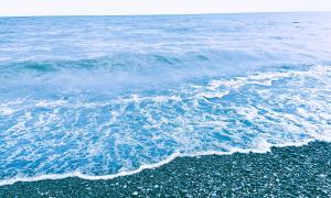 Waves on a pebble beach, Port Stanley, Ontario. Great Lakes Water in Action. Patrick Lawrence
